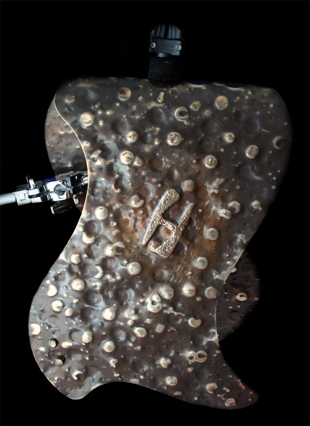 blank A 1/2" hole drilled into the centre of the fold allows the Hybrid to mount on an existing cymbal stand